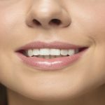 young woman face Big lips smiling